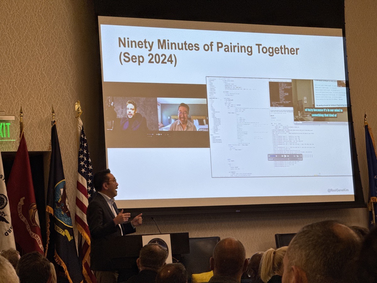 Gene Kim presenting at the AFCEA San Diego Mission Systems Symposium, 15 September 2026, in front of a slide titled "Ninety Minutes of Pairing Together (Sep 2024)".